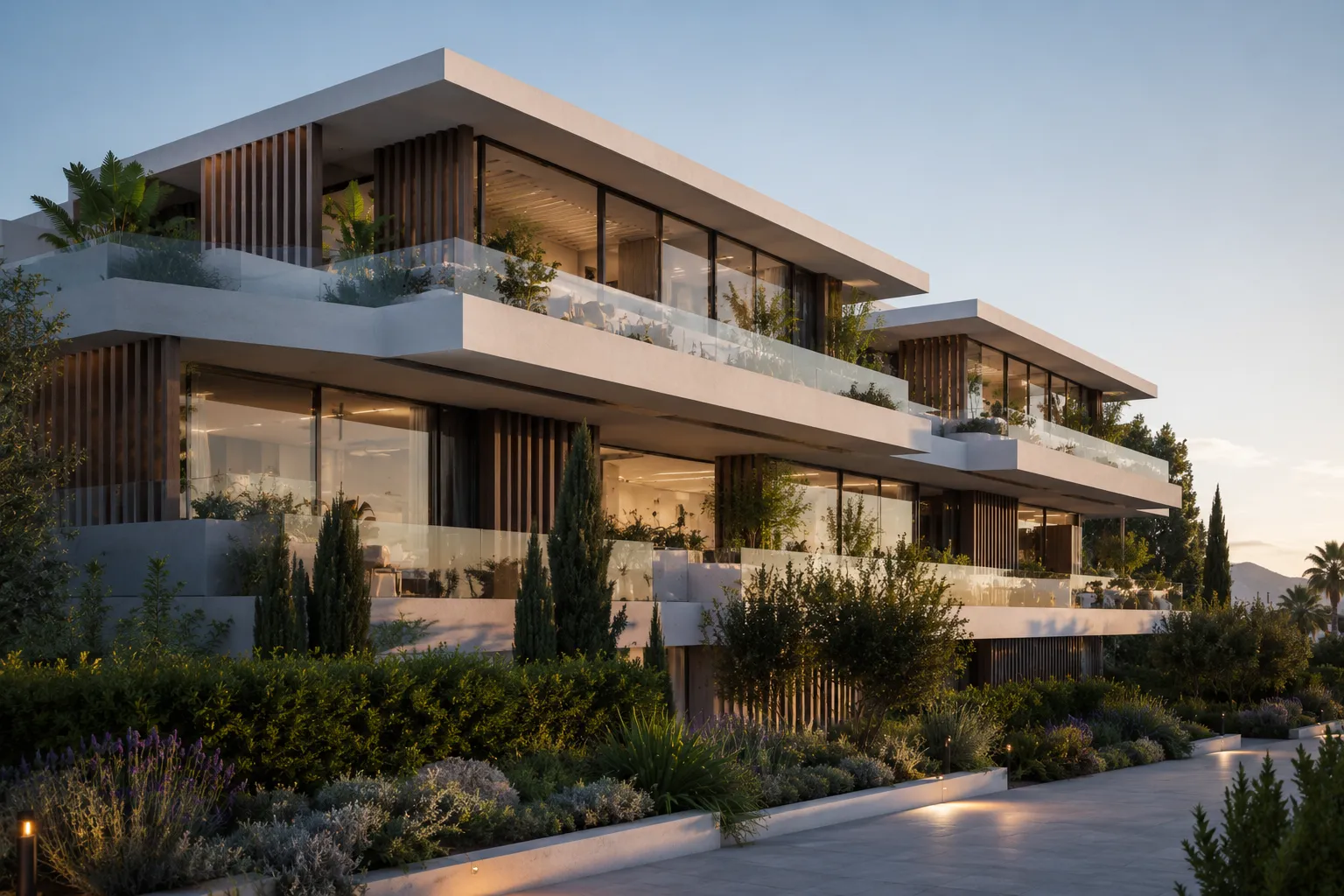 A contemporary residential building on the Costa del Sol with horizontal lines, large glass, integrated terraces and mature Mediterranean landscaping, framing new developments and branded residences for luxury buyers