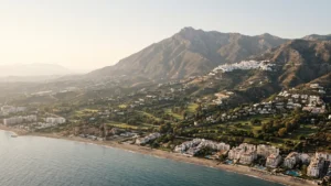 The Mijas landscape rising from the beachfront apartments through the golf valley to the white village high on the Sierra de Mijas