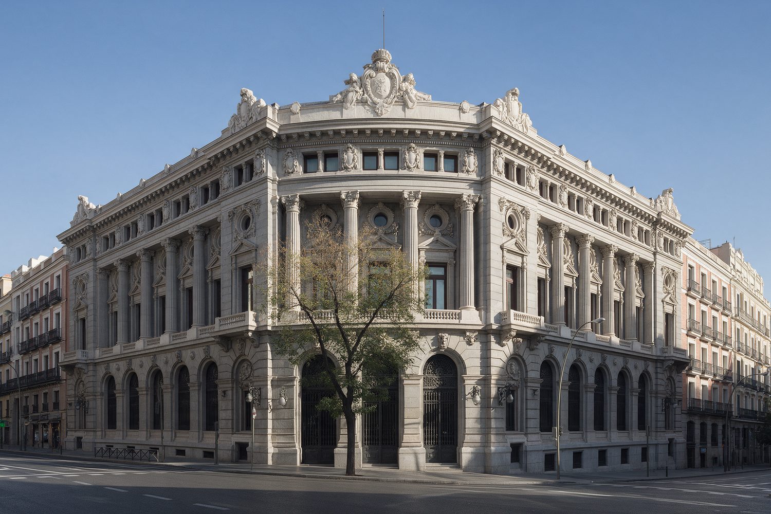 Ornate 19th-century central bank building on a Madrid street corner in morning light